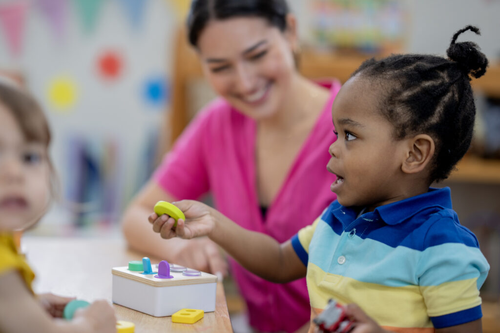 Teacher interacting with student to build social skills